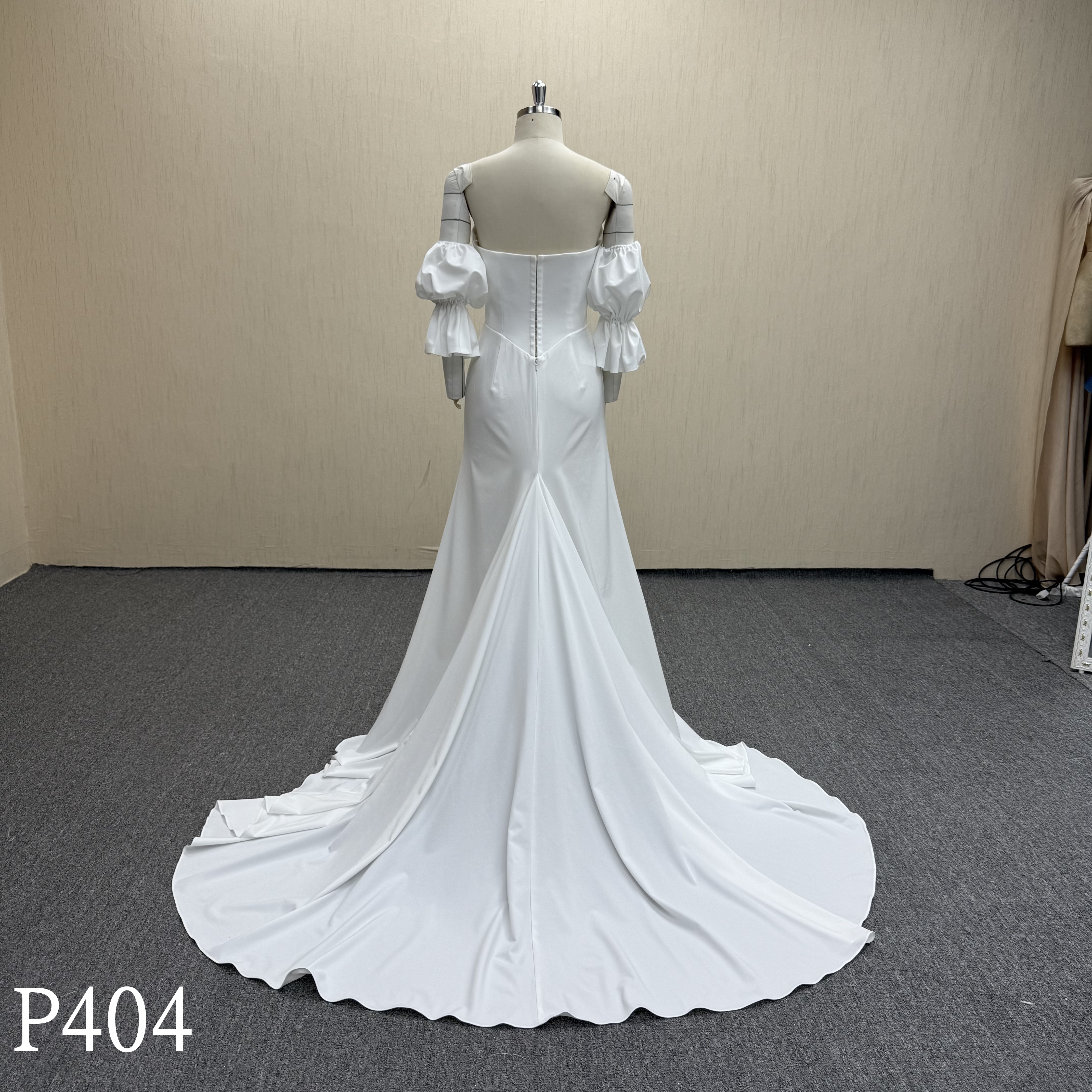 P404 Glamorous Backless Satin Wedding Dress with Dramatic Sleeves.