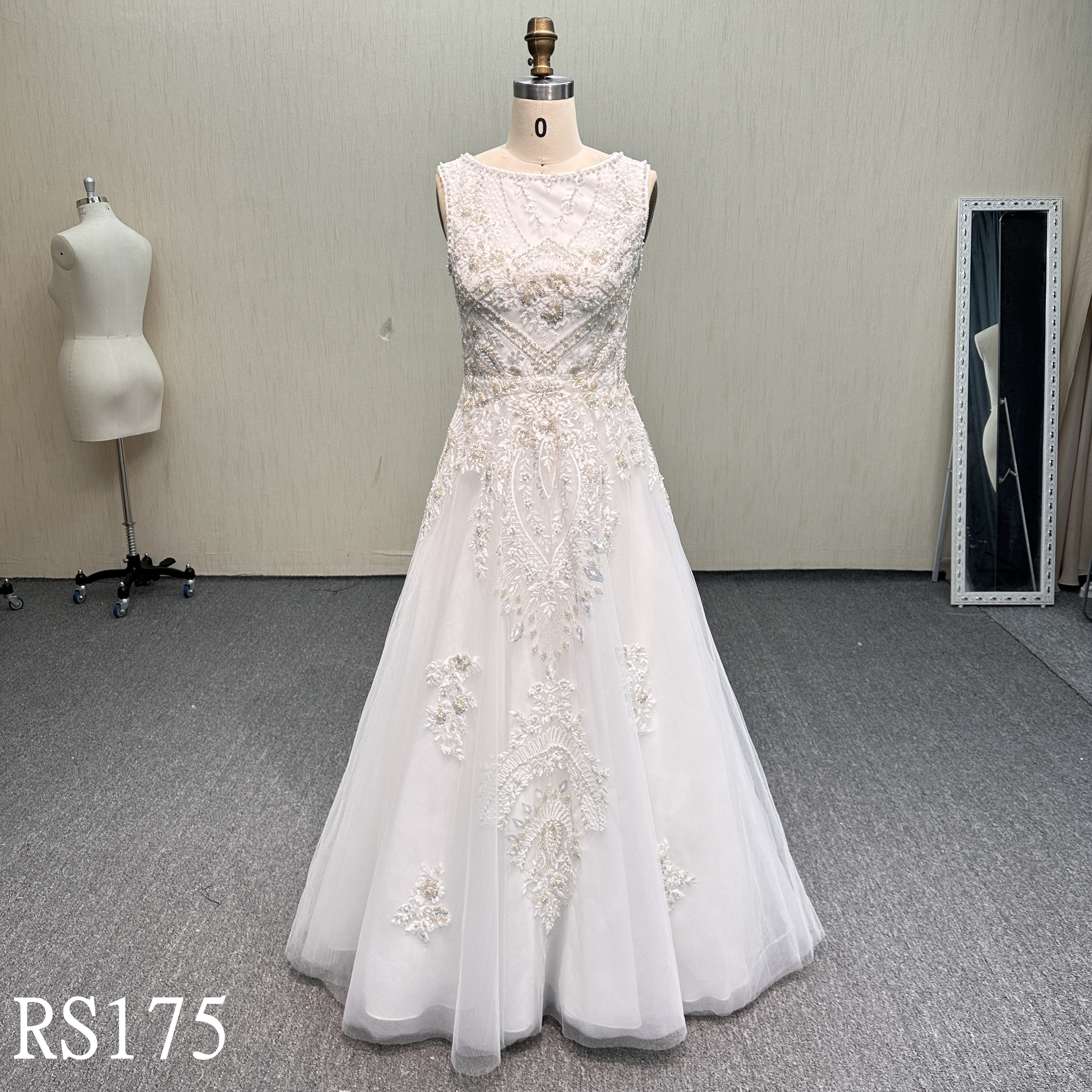RS175 Regal Charm: Sleeveless Illusion Neck Beaded Lace Gown with Symmetrical Motifs