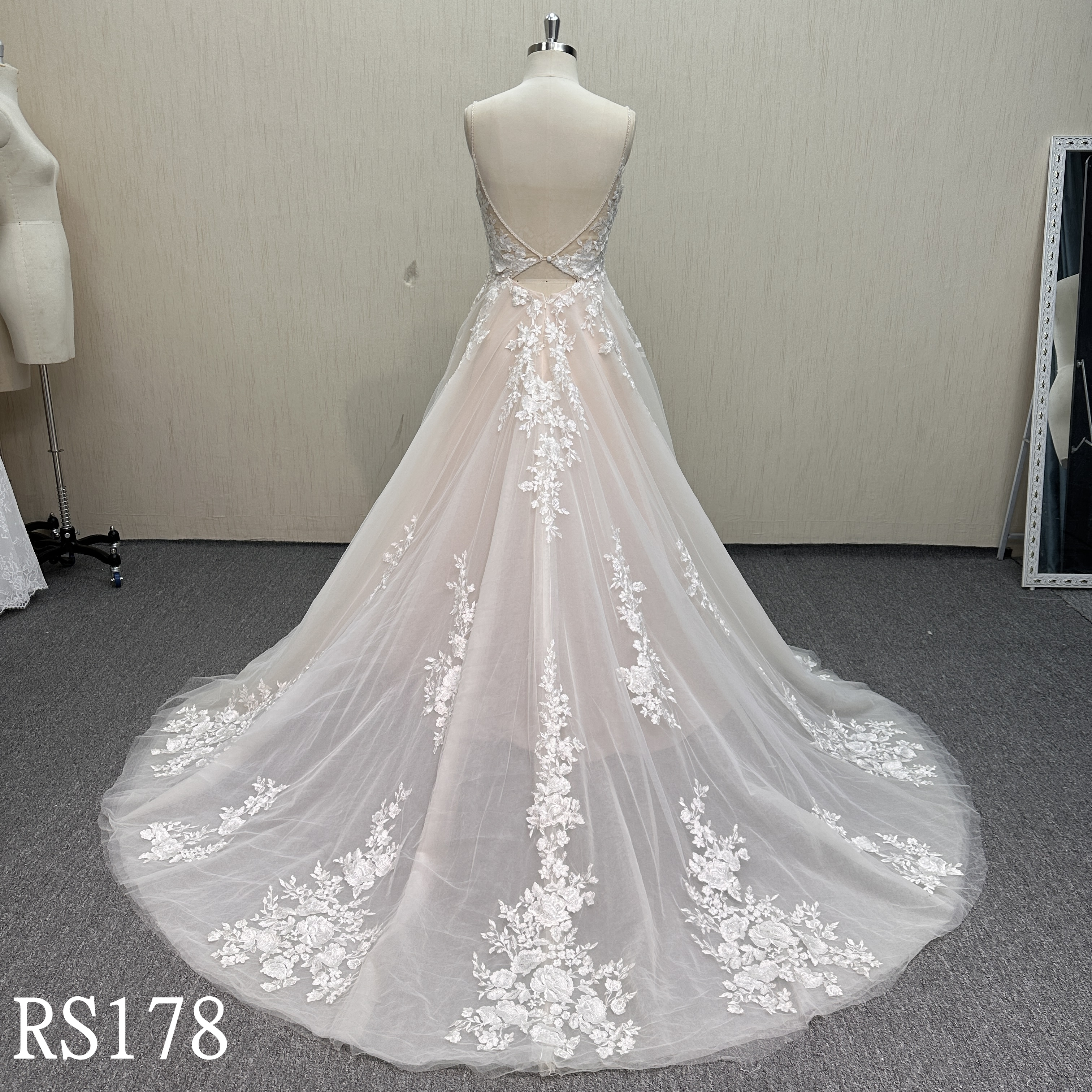RS178 Modern Romance: Layered Tulle Gown with 3D Lace Appliqués and Criss-Cross Back