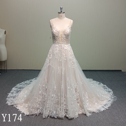Stunning Blush Tulle A-Line Bridal Gown with Deep V-Neck and Crisscross Back