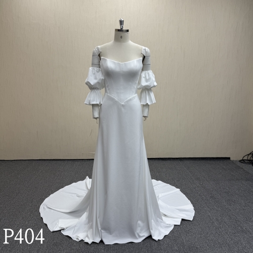 P404 Glamorous Backless Satin Wedding Dress with Dramatic Sleeves.