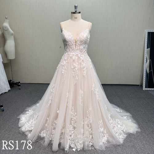 RS178 Modern Romance: Layered Tulle Gown with 3D Lace Appliqués and Criss-Cross Back